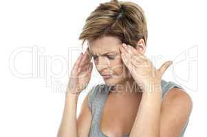 Woman having headache. Holding her head