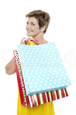 Blonde with shopping bags tossed over her shoulders