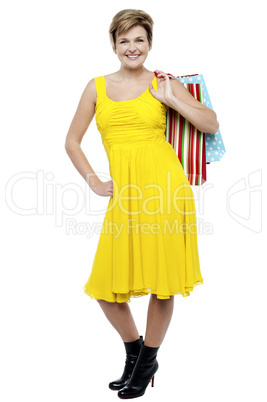 Portrait of a happy woman carrying shopping bags