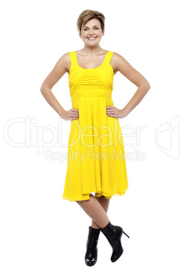 Attractive blonde wearing bright yellow frock