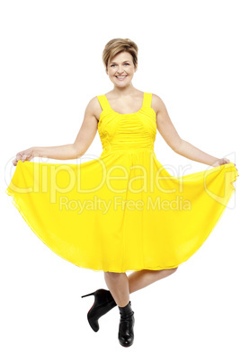 Attractive smiling female in bright summer dress