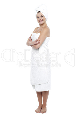 Pretty woman wrapped in white towel after bath