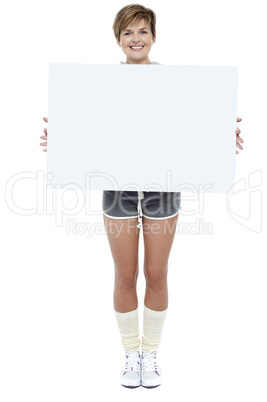 Pretty woman presenting blank whiteboard