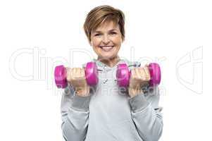 Beautiful young woman with dumbbells