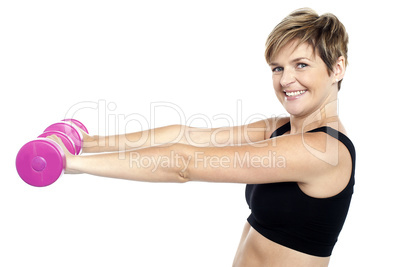 Young beautiful woman with dumbbells in hands