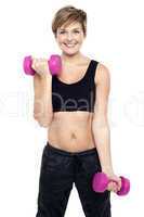 Cheerful middle-aged woman woman working out