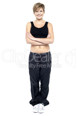 Full length portrait of fit lady in gym wear