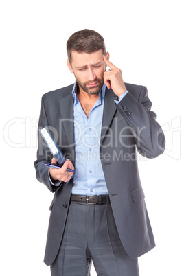 Portrait of thoughtful business man with diary