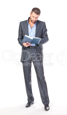 Full length portrait of thoughtful business man with diary