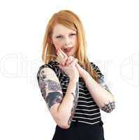 Red Head Looking Sultry at Camera with Hands in Shape of a Gun w