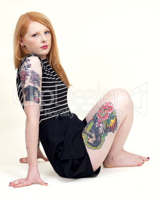 Strawberry Blonde Sat Down Leaning Back on her Arms Isolated
