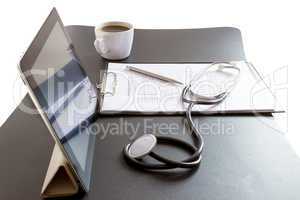 Tablet Pc and Stethoscope on desk