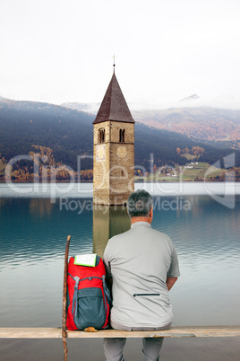 Man makes break from hiking and enjoying the view