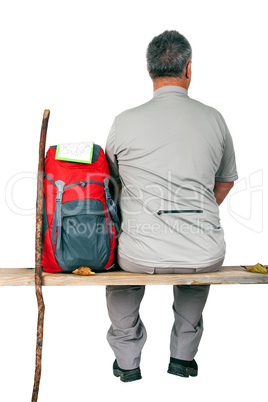 Man with backpack sitting on the bench