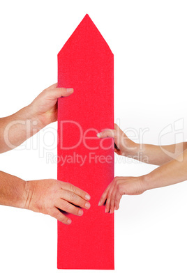 Woman hand and man's hand holding directional arrow