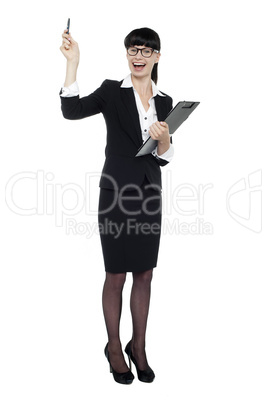 Cheerful businesswoman posing with raised arm