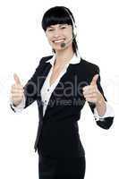 Gorgeous telecaller showing double thumbs up