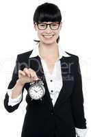 Smiling young lady holding old fashioned time piece