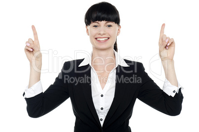 Smiling woman posing with raised fingers