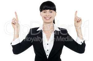 Smiling woman posing with raised fingers