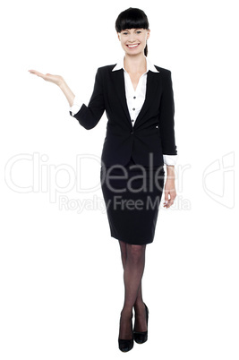 Young beautiful businesswoman showing copy space