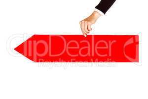Woman's hand holding directional arrow