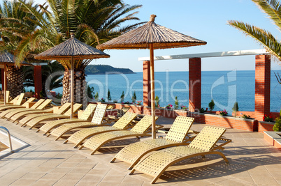 Sunbeds near swimming pool at the modern luxury hotel, Thassos i