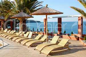 Sunbeds near swimming pool at the modern luxury hotel, Thassos i