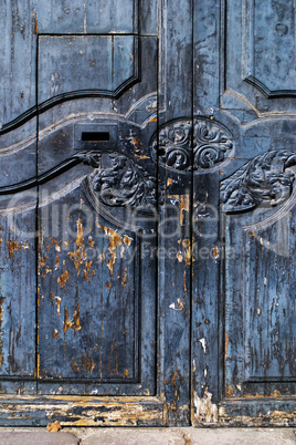 Rustic Spanish door with flaking paint