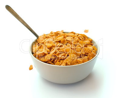 Bowl of corn flake cereal with a spoon