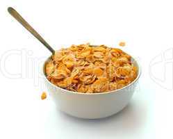 Bowl of corn flake cereal with a spoon