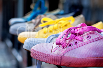 Colourful plimsolls in a row