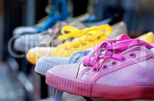 Colourful plimsolls in a row