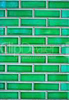 Green brick wall with white cement