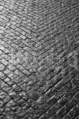 Grey cobbled street in a V shape