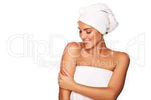 Beautiful woman caressing her skin