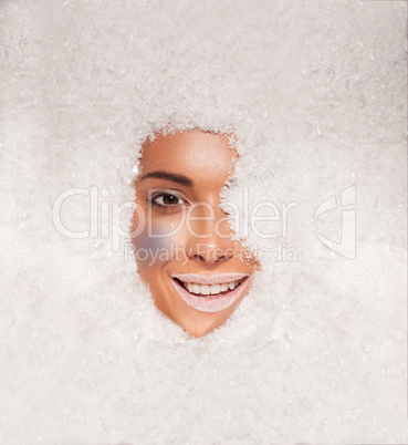 Beautiful woman covered in snow