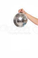 Silver disco ball over white