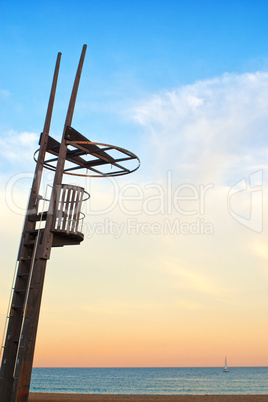 Empty lifeguard perch overlooking Mediterranean sunset