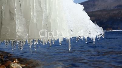 Icicle hanging over water
