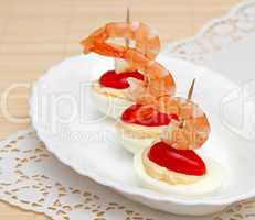 Canape with egg and a shrimp