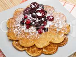 Wafers with berries and powdered sugar