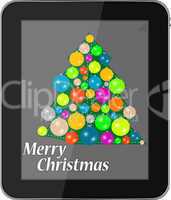 Elegant christmas tree with balls on tablet pc
