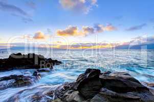 Blue water of ocean in Hawaii during sunset.