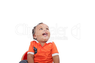 Baby laughing over white background. Active one year child