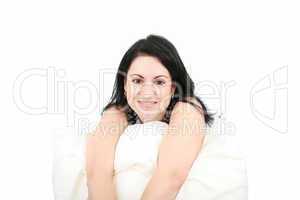 Portrait of a happy young woman smiling against white background