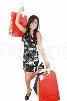 Shopping woman happy smiling holding shopping bags isolated on w