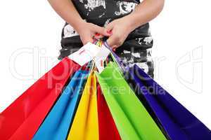 woman hands holding shopping bags isolated on white. Focus on ha