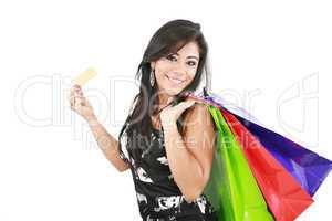Young woman with shopping bags and credit card on a white backgr