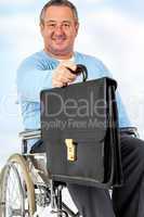 Friendly man in a wheelchair presents briefcase